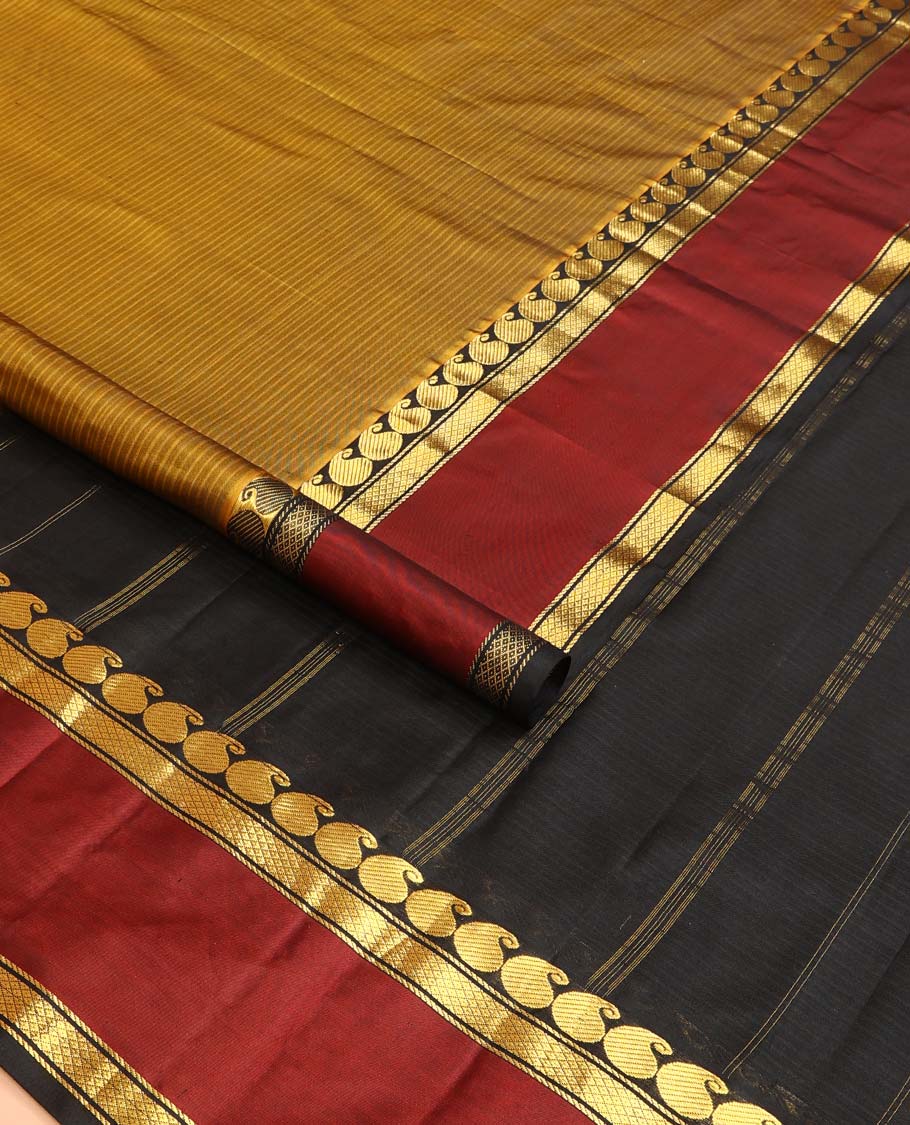 Mustard striped Kanchipuram silk saree, contrast rettai pettu border of manga and mayil kann designs, and zari striped pallu