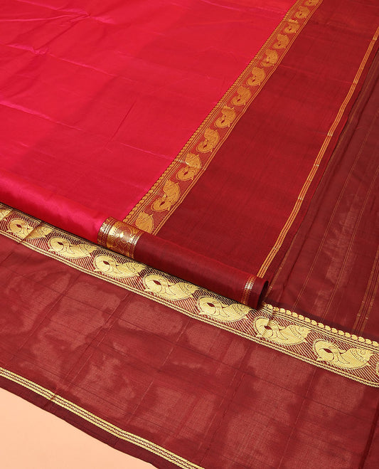 Red Plain Kanchipuram Silk Saree, Complemented by a Contrast Rettai Pettu Border of Manga, Neli, Banaras, and Meen Designs, Pallu of Zari Designs, and Paired with a Contrast Blouse