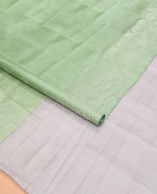 Light Pista Green Mayuri Soft Silk Saree Sparsely Sparkled with Buttas, Subtly Woven Border of Floral Zari Designs, Pallu of Sparsely Woven Geometric Textures, and Paired with a Contrast Blouse