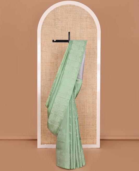 Light Pista Green Mayuri Soft Silk Saree Sparsely Sparkled with Buttas, Subtly Woven Border of Floral Zari Designs, Pallu of Sparsely Woven Geometric Textures, and Paired with a Contrast Blouse