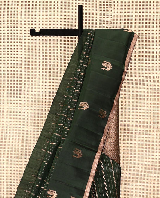 Green Mayuri Soft Silk Saree, Mesmerized with Neli, and Muthu Designs  All Over Its Body, Highlighted by Zari Border of Peacock Designs, Boldly Accentuated Jaal Pallu, and Paired with a Matching Blouse