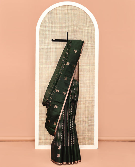 Green Mayuri Soft Silk Saree, Mesmerized with Neli, and Muthu Designs  All Over Its Body, Highlighted by Zari Border of Peacock Designs, Boldly Accentuated Jaal Pallu, and Paired with a Matching Blouse