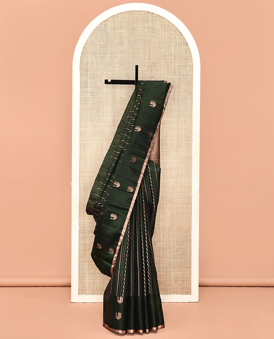 Green Mayuri Soft Silk Saree, Mesmerized with Neli, and Muthu Designs  All Over Its Body, Highlighted by Zari Border of Peacock Designs, Boldly Accentuated Jaal Pallu, and Paired with a Matching Blouse