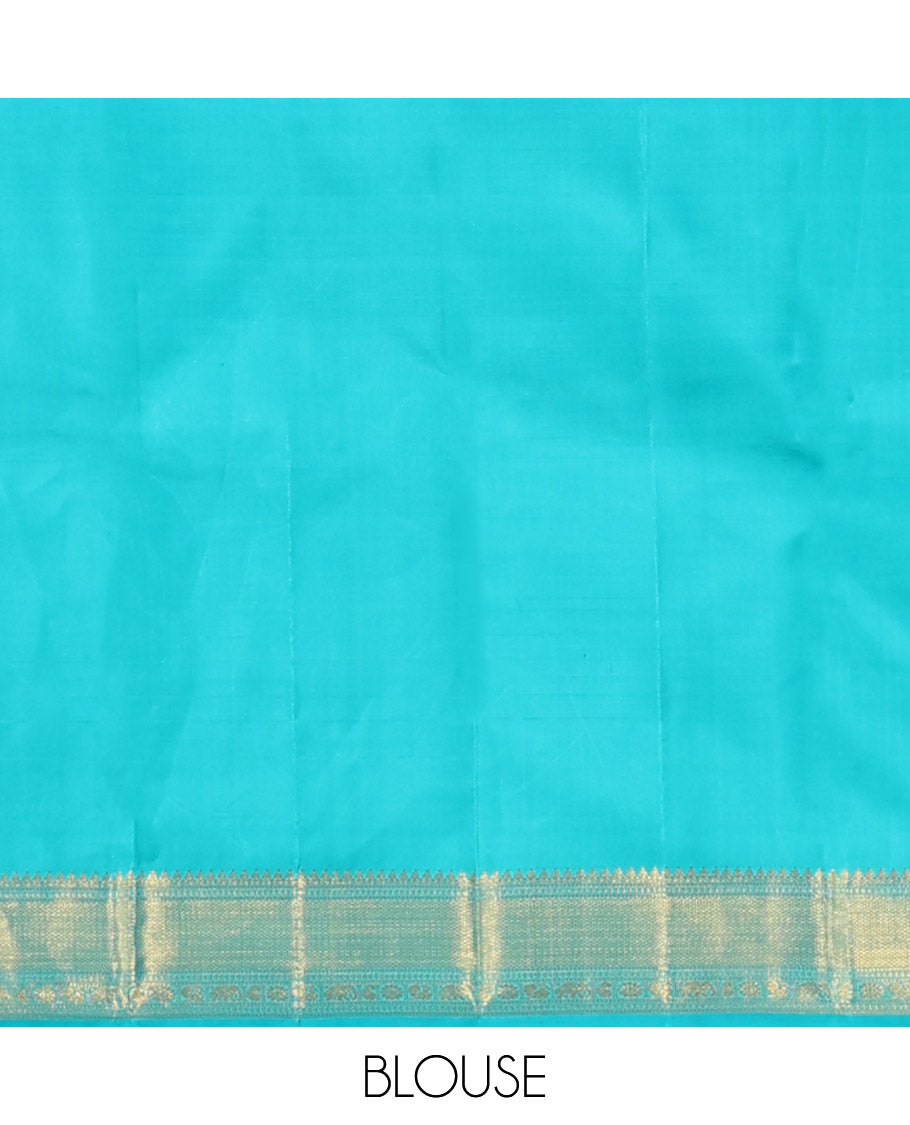 Yellow embossed silk saree, contrast border of thilakam mokku, muthu, ara bogudi, and kuyil kann, and jaal pallu