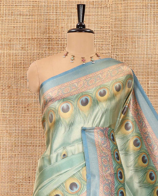 Peacock green peacock feather motifs printed tissue satin saree, contrast peacock motifs feather printed border, figurines printed pallu, and a contrast peacock motifs printed blouse
