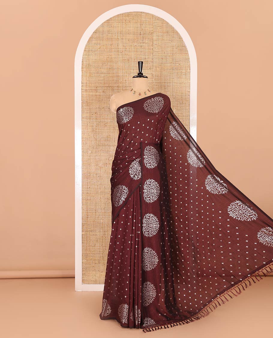 Maroon plus buttas woven Vichitra silk saree, kalpavriksha tree motifs woven on its border, self-pallu, and no blouse
