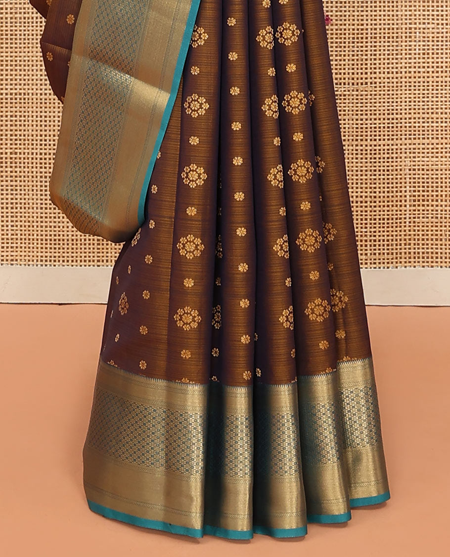 Brown Vasundhara Lite Silk Mix Saree Adorned with Zari Buttas, Complemented by a Contrast Border Featuring Ara Bogudi, Kathir, and Floral Designs, a Pallu Showcasing Floral Motifs, Paired with a Contrast Blouse
