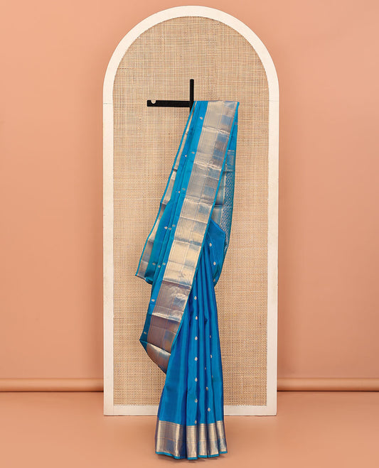 Purple Vasundhara Lite Silk Mix Saree Subtly Sparked with Zari Buttas, Highlighted with a Border of Thilakam Mokku, Banaras, Mayil Kann, Vanki, and Ara Maadam Designs, Pallu Accentuated with Jaal Design, and Paired with a Matching Blouse