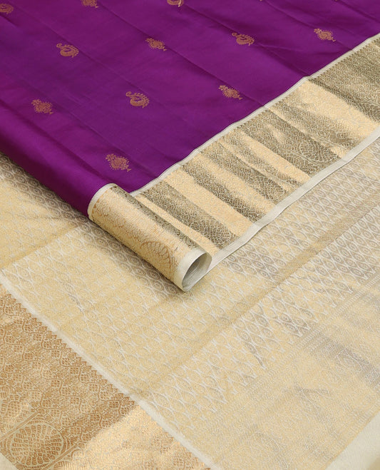 Purple zari buttas silksaree, contrast pallu of peacock feather-shaped motifs & border of rekku,paisa,kodi visiry & mayil chakra