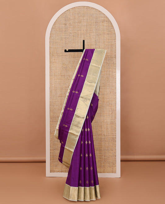 Purple zari buttas silksaree, contrast pallu of peacock feather-shaped motifs & border of rekku,paisa,kodi visiry & mayil chakra