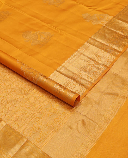 Yellow yaanai & singam buttas silksaree,zari border of thilakam,yaanai,mayil kann,rudraksham,muthu, mayil & yaali & butta enclosed checked pallu