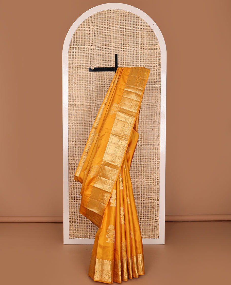 Yellow yaanai & singam buttas silksaree,zari border of thilakam,yaanai,mayil kann,rudraksham,muthu, mayil & yaali & butta enclosed checked pallu