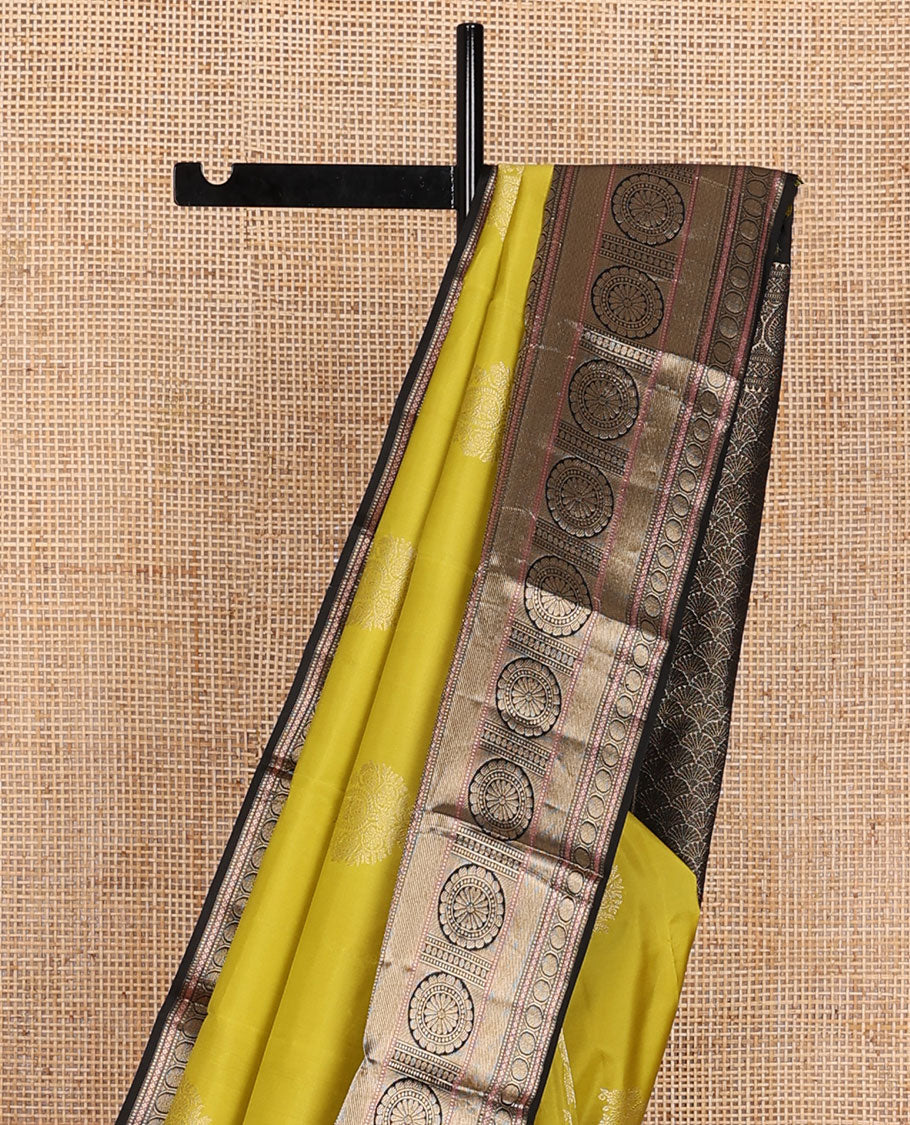 Yellow manga buttas silk saree, contrast border of muthu, diamond,poun, zari stripes & chakram designs & scallop design pallu