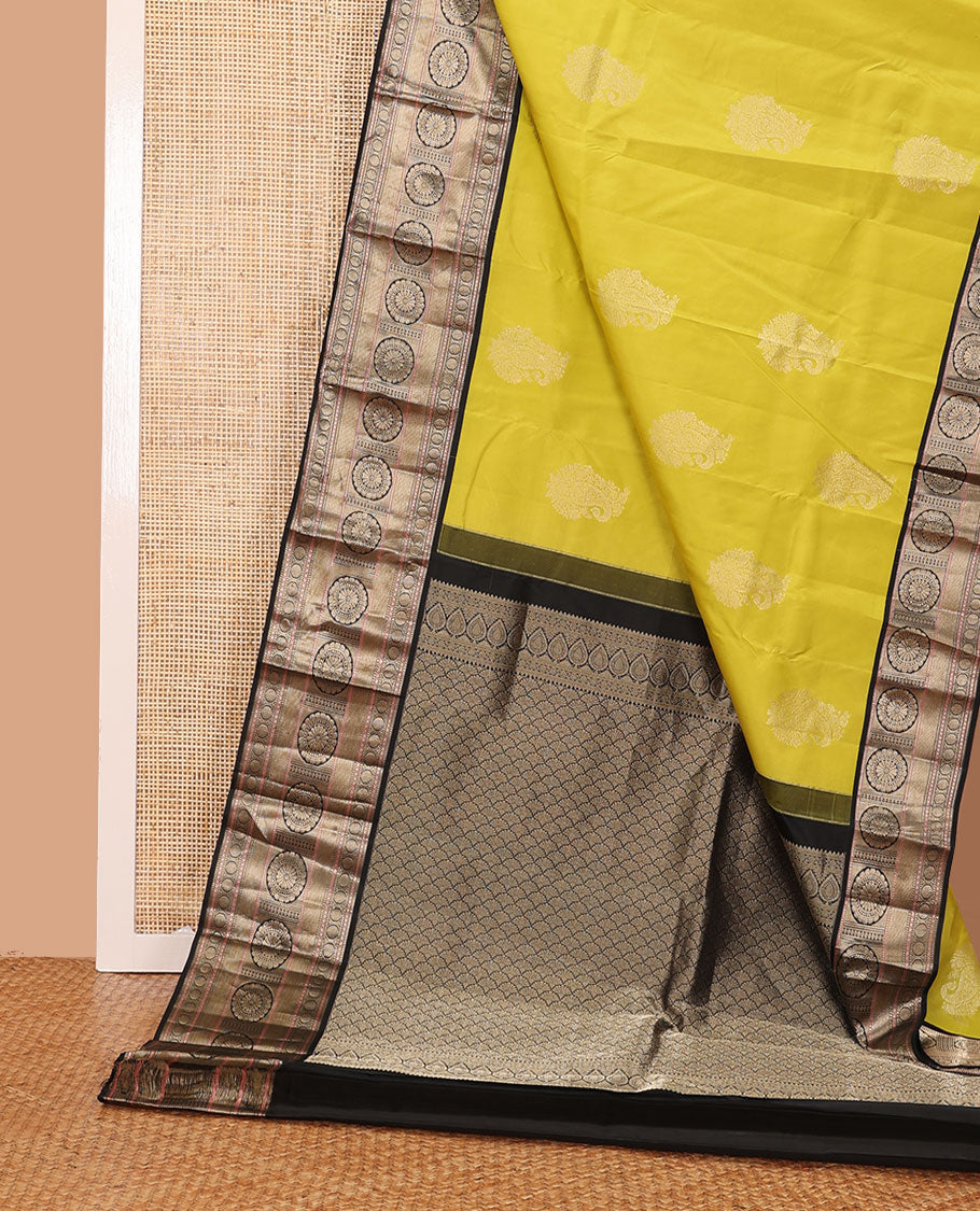 Yellow manga buttas silk saree, contrast border of muthu, diamond,poun, zari stripes & chakram designs & scallop design pallu