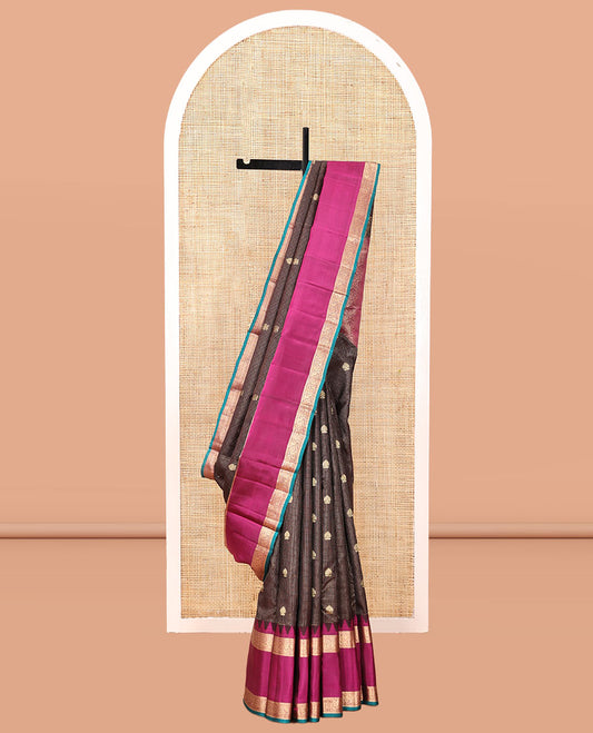 Brown Vasundhara Silk Saree, Elegantly Highlighted with Zari Buttas and Checks, a Contrast Temple Rettai Pettu Border of Thilakam Mokku, and Mayil, Intricate Pallu, and a Contrast Blouse