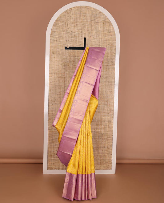 Yellow jacquard wedding silk saree, contrast border of thilakam, poun, chakram, mayil, yaali & vangi & jaal pallu