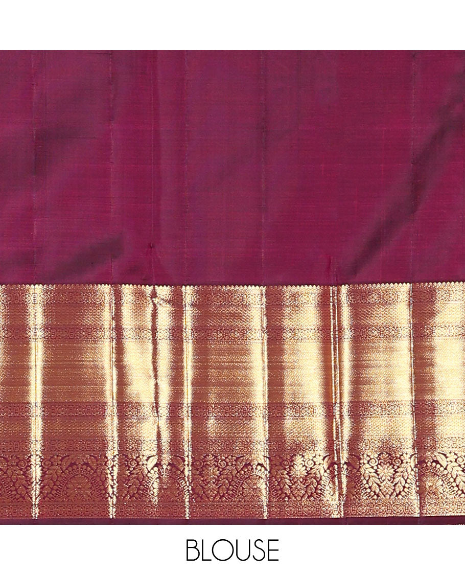 Maroon jacquard kanchipuram silk saree, zari border of traditional zari designs, and zari-rich pallu