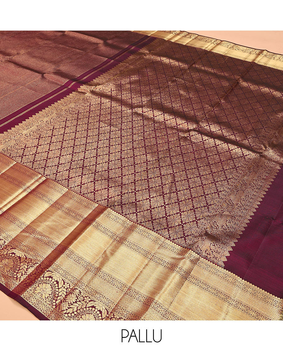 Maroon jacquard kanchipuram silk saree, zari border of traditional zari designs, and zari-rich pallu