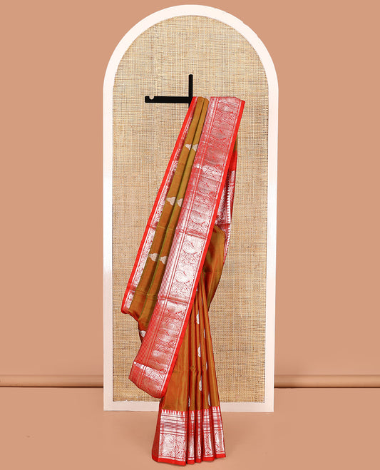 Green buttas Venkatagiri silk saree, contrast temple traditional border of peacocks, and intricate pallu