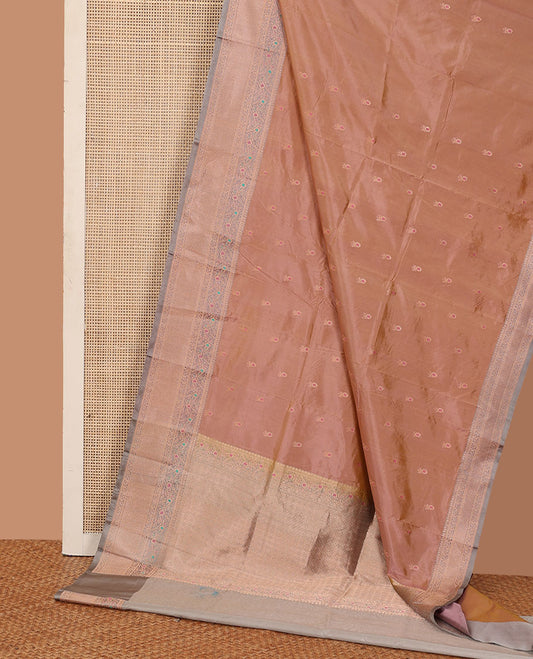 Pinkish peach dual tone zari buttas katan silk saree, contrast traditional zari border of floral meenakari motifs, and jaal pallu
