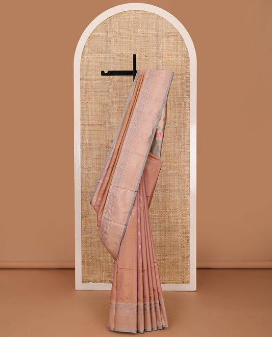 Pinkish peach dual tone zari buttas katan silk saree, contrast traditional zari border of floral meenakari motifs, and jaal pallu