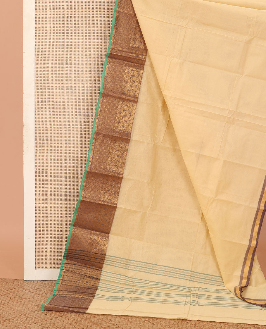 Cream plain Chettinad cotton saree, contrast temple traditional zari border, and striped pallu