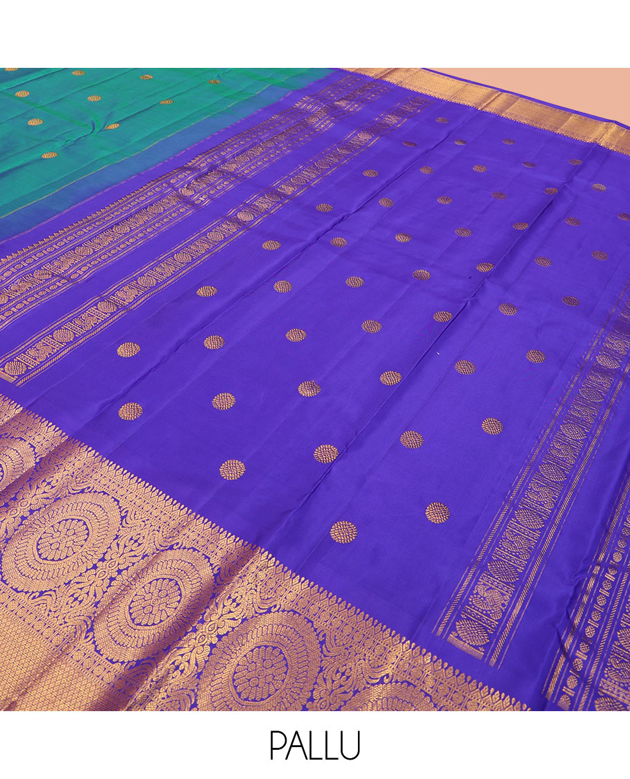 Blue chakram buttas Kanchipuram silk saree, contrast border of muthu, rudraksham,  poo chakram, and mayil kann designs, and chakram motifs pallu