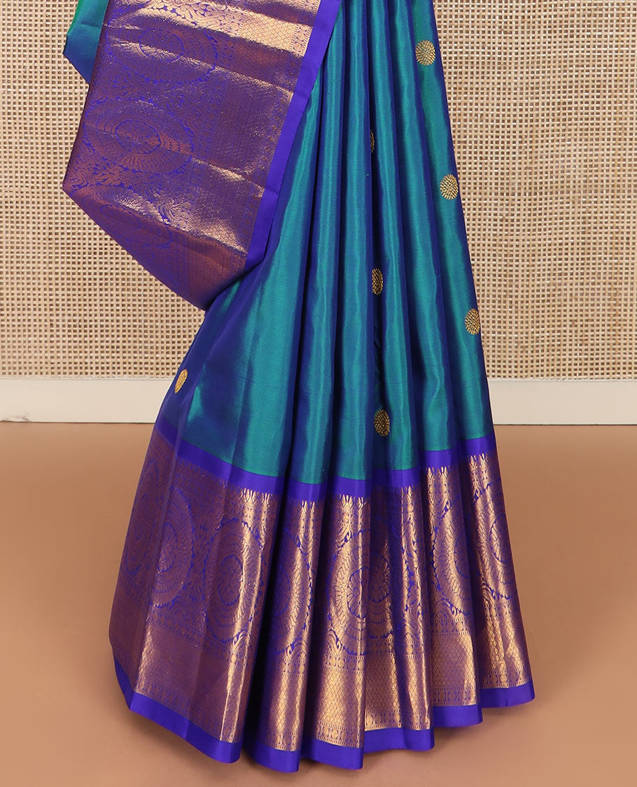 Blue chakram buttas Kanchipuram silk saree, contrast border of muthu, rudraksham,  poo chakram, and mayil kann designs, and chakram motifs pallu
