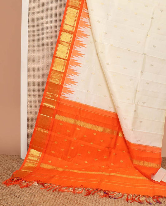 White floral buttas kancheepuram silk saree with contrast border of rekku, thilakam mokku, banaras design & floral pallu