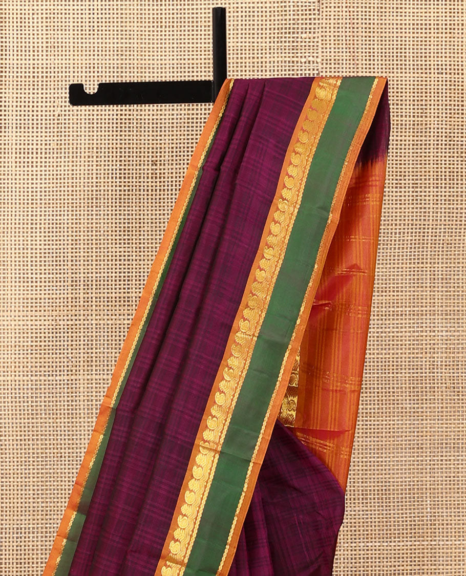Purple Kanchipuram silk saree, contrast rettai pettu border of manga, neli, and diamond designs, and zari striped pallu
