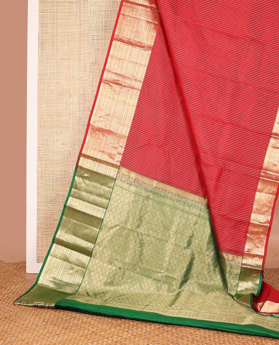 Red muthu striped silk saree, zari border of thilakam,ara bogudi, diamond, rettai neli, jaal and kodi visiry, and contrast jaal pallu