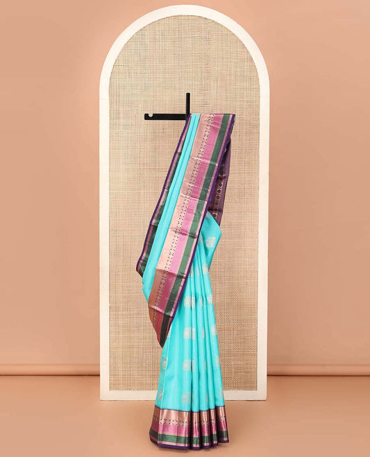 Blue yaanai buttas silk saree, contrast border of rekku, muthu, banaras, mayil kann, and rudraksham motifs, and jaal pallu