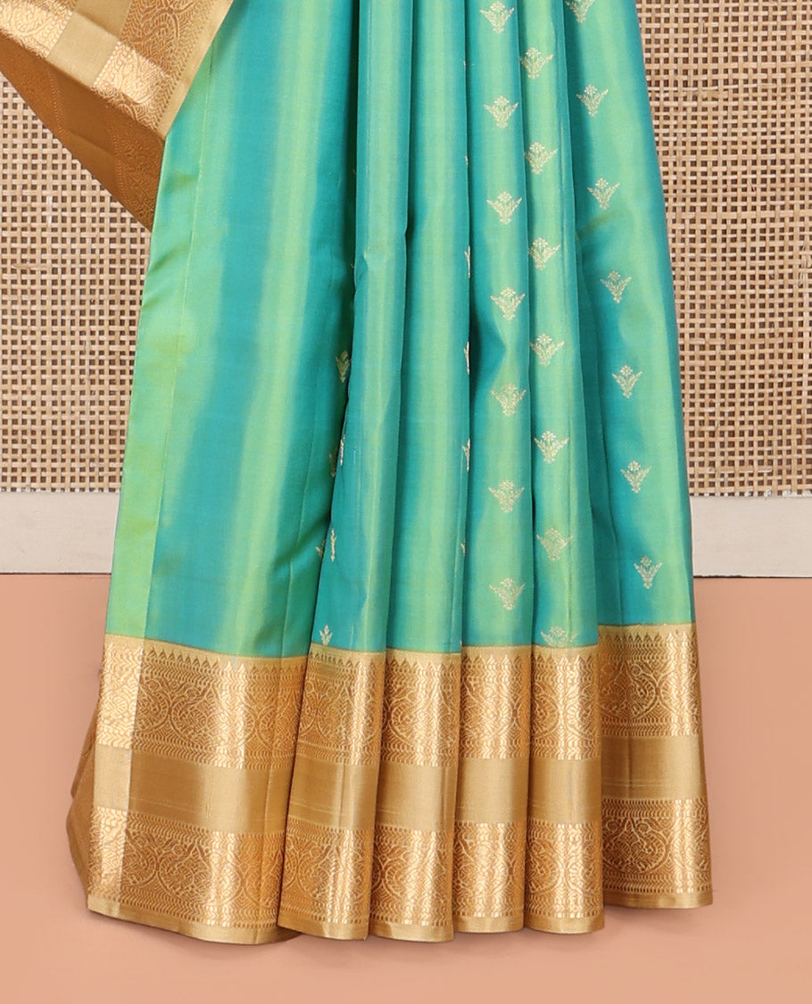 Turquoise Vasundhara Silk Saree, Crafted with Zari Buttas All Over Its Body, Complemented by a Contrast Rettai Pettu Border of Rekku, Muthu, Kathir, and Mayil Designs, Intricately Designed Pallu, and Paired with a Contrast Blouse
