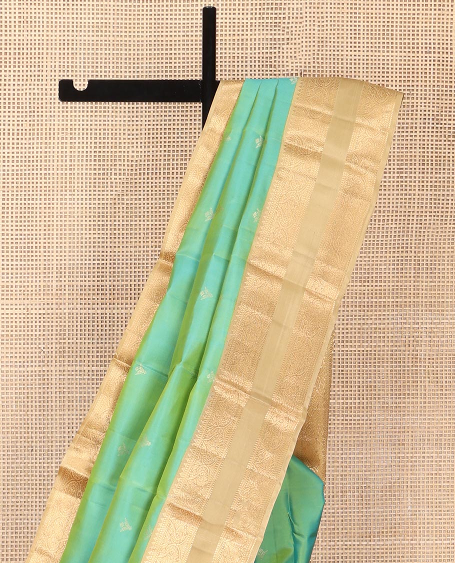 Turquoise Vasundhara Silk Saree, Crafted with Zari Buttas All Over Its Body, Complemented by a Contrast Rettai Pettu Border of Rekku, Muthu, Kathir, and Mayil Designs, Intricately Designed Pallu, and Paired with a Contrast Blouse
