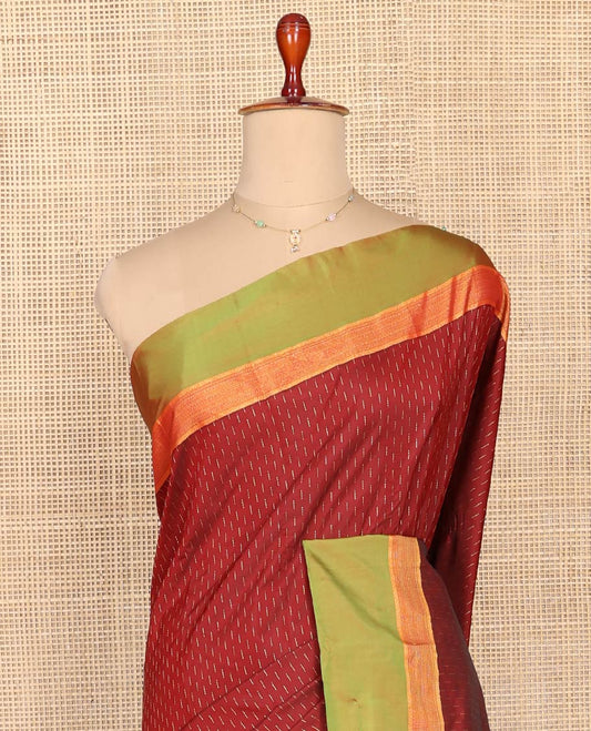 Maroon Aarani Silk Saree, Detailed with Zari Buttas on Its Body, Complemented by a Contrast Zari Border, Pallu of Stripes and Buttas, and Paired with a Contrast Blouse