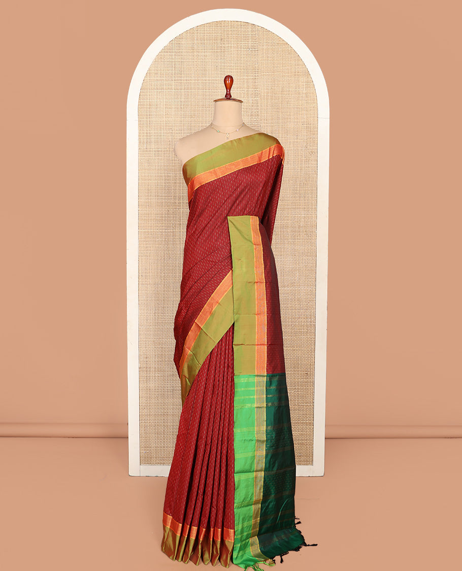 Maroon Aarani Silk Saree, Detailed with Zari Buttas on Its Body, Complemented by a Contrast Zari Border, Pallu of Stripes and Buttas, and Paired with a Contrast Blouse
