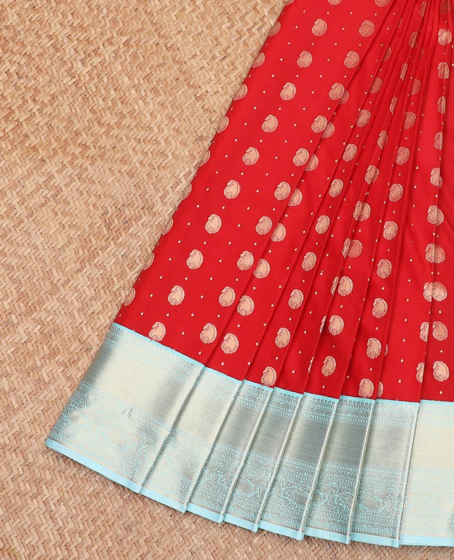 Red Budget Silk Saree Spotlighted with Zari Buttas and Paisley Buttas, Complemented by a Contrast Border of Traditional Zari Designs, Subtly Designed Pallu of Geometric Designs, and Paired with a Contrast Blouse