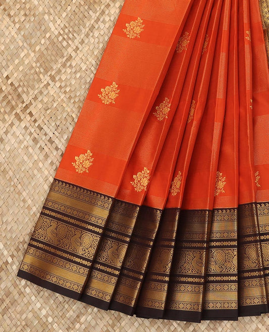 Rust orange floral buttas and striped budget silk saree, contrast traditional zari design border, and jaal pallu