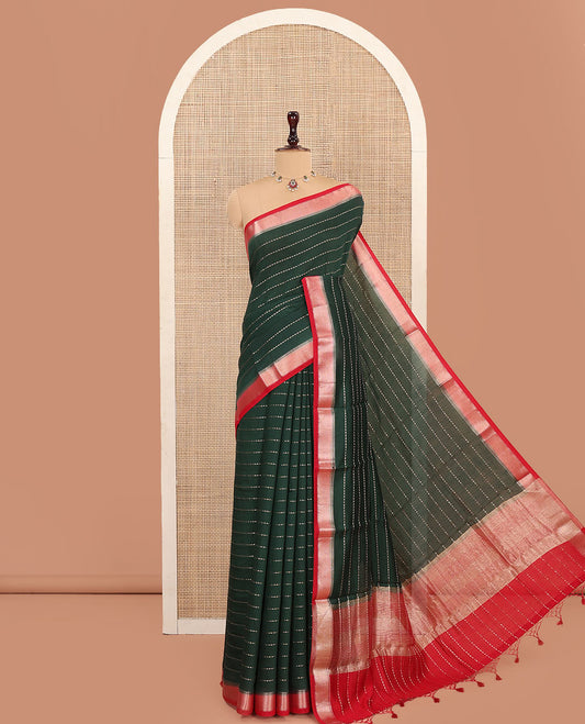 Green Assam Silk Saree, Detailed with Zari Stripes on Its Body, Complemented by a Contrast Zari Chevron Striped Border, Pallu Steeped with Zari Stripes, and Paired with a Contrast Blouse