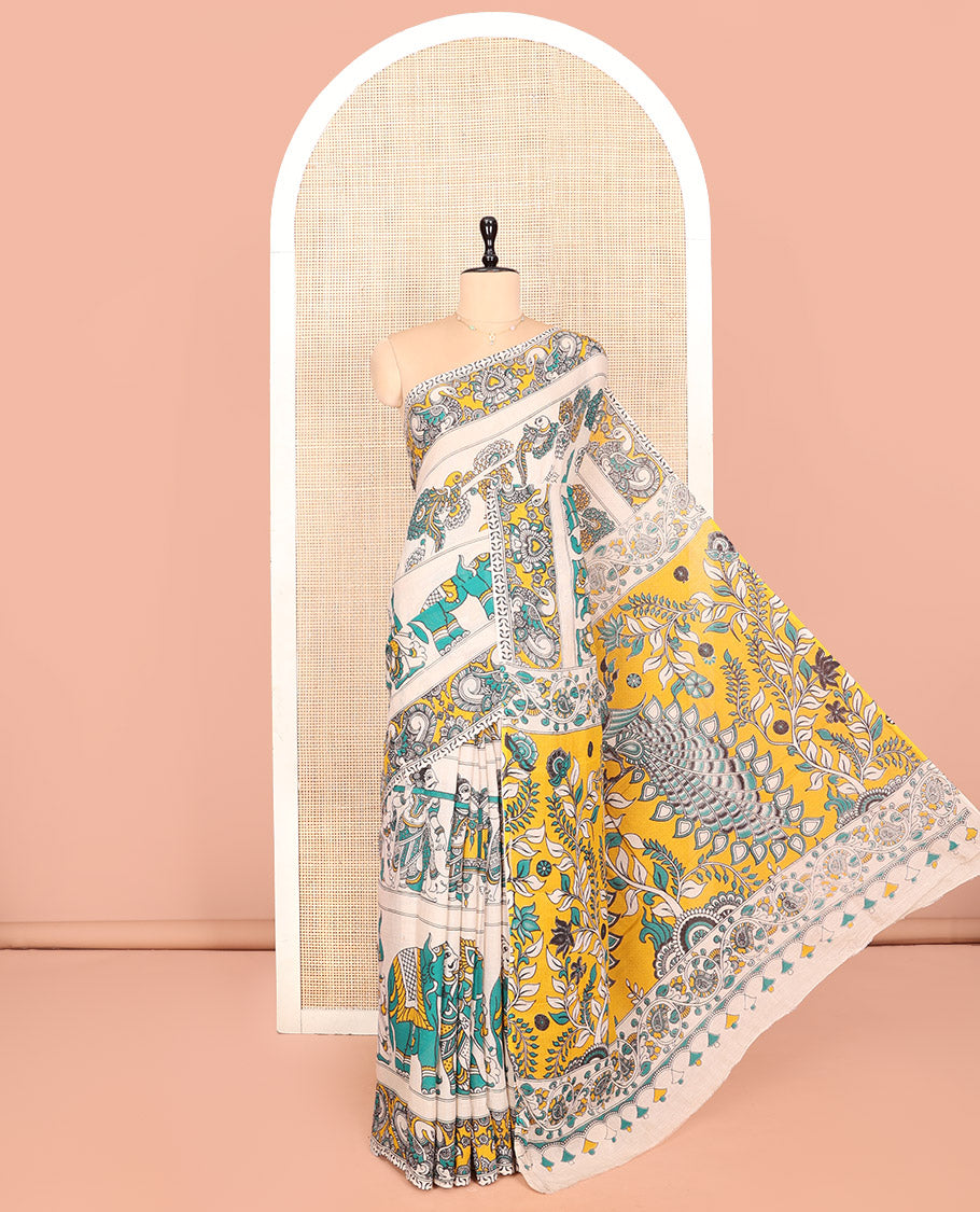 Off-White Kalamkari Cotton Saree Features Flora, Fauna, Human Motifs Print, Contrast Kalamkari Printed Border, Peacock Pallu, and a Matching Blouse