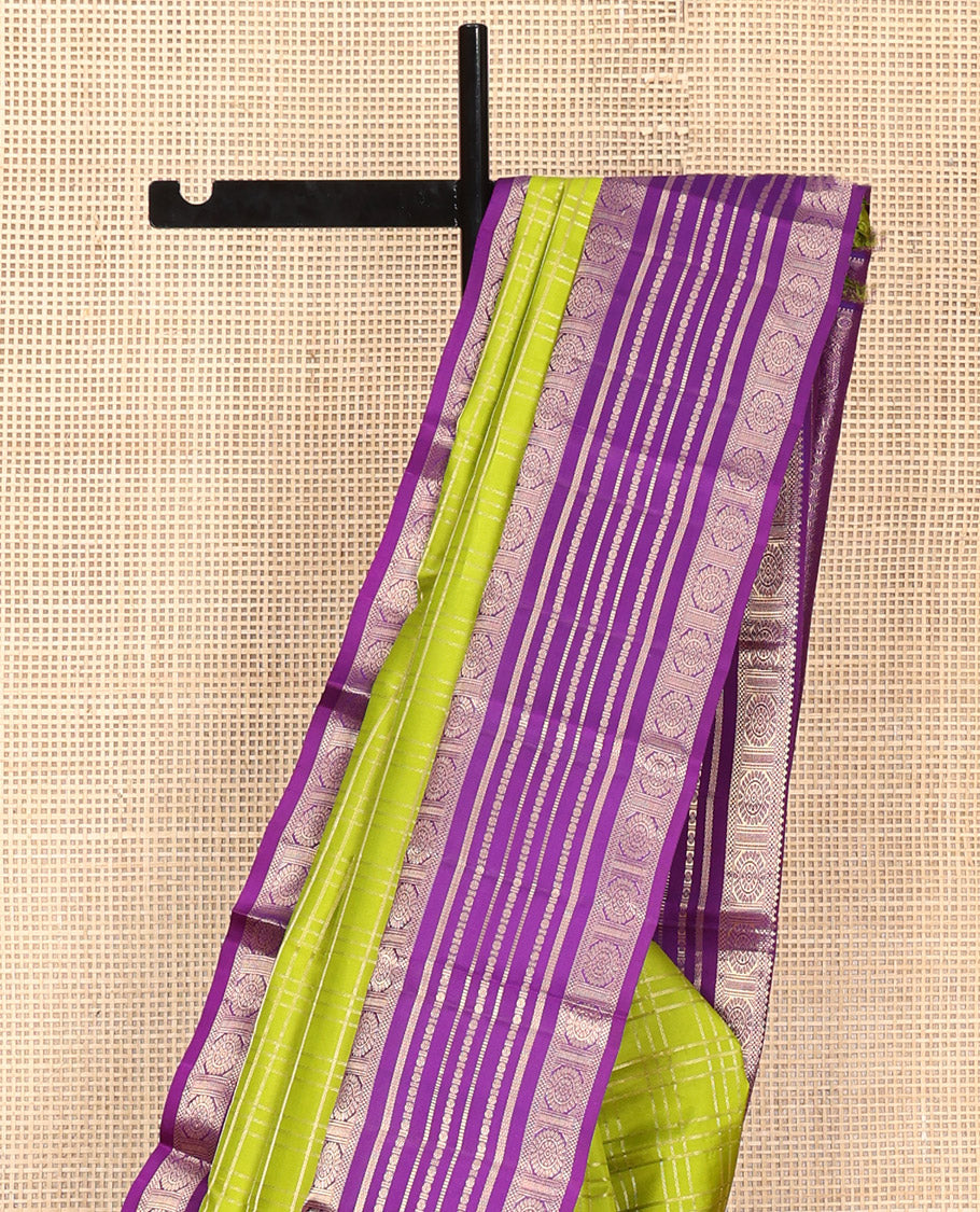 Green Vasundhara Silk Saree, Spotlighted with Zari Checked Design All Over Its Body, Complemented by a Contrast Varisai Pettu Border of Muthu, Poun, and Chakram Designs, Grandly Embellished Pallu of Jaal Designs, and Paired with a Contrast Blouse