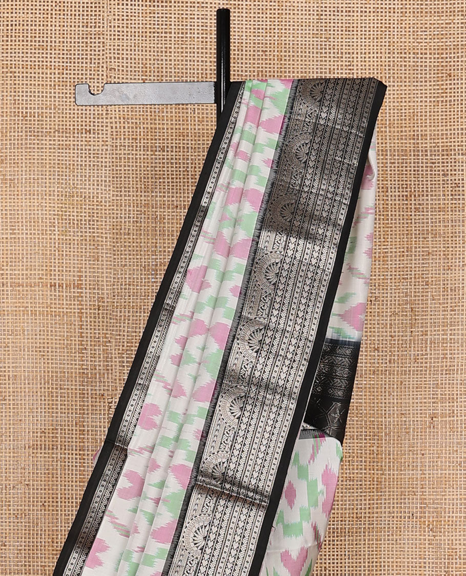 Half-white colorful jaal-patterned pure ikkat saree, contrast traditional zari design black border & pallu of geometric zari designs