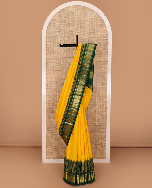 Yellow zari buttas Kanchipuram silk saree, contrast one-sided thazampoo rekku micro-checked border of salangai,banaras & jaal & zari design pallu