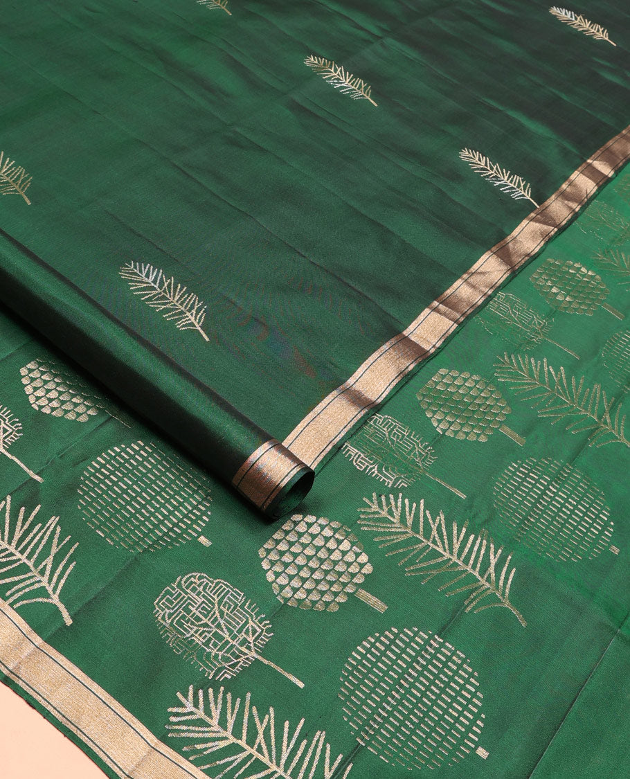 Green leaf buttas soft silk saree, piping zari border, and pallu steeped with unique leaf motifs