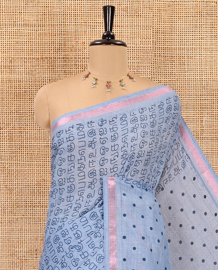 Grey tamil letters printed soft cotton saree, zari piping border, small polka dotted pallu, and blouse of abstract and polka dots print