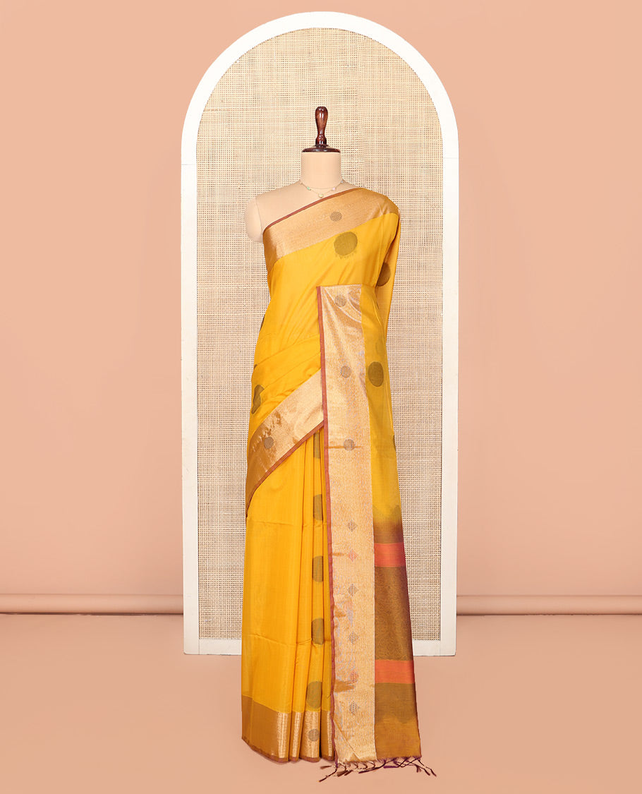 Mustard Silk Cotton Saree, Spotlighted with Round Buttas All Over Its Body, Complemented by Contrast Border, Sparsely Woven Pallu, and Paired with a Contrast Blouse