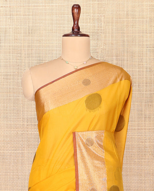 Mustard Silk Cotton Saree, Spotlighted with Round Buttas All Over Its Body, Complemented by Contrast Border, Sparsely Woven Pallu, and Paired with a Contrast Blouse
