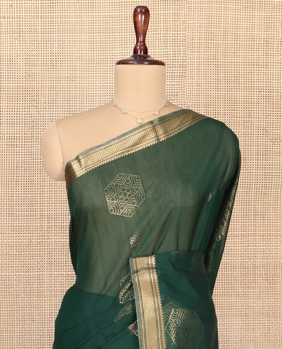 Green Silk Cotton Saree, Embellished with Geometric Buttas All Over Its Body, Highlighted by Traditional Zari Designs Woven Border, Grand Jaal Pallu and Paired with a Matching Blouse