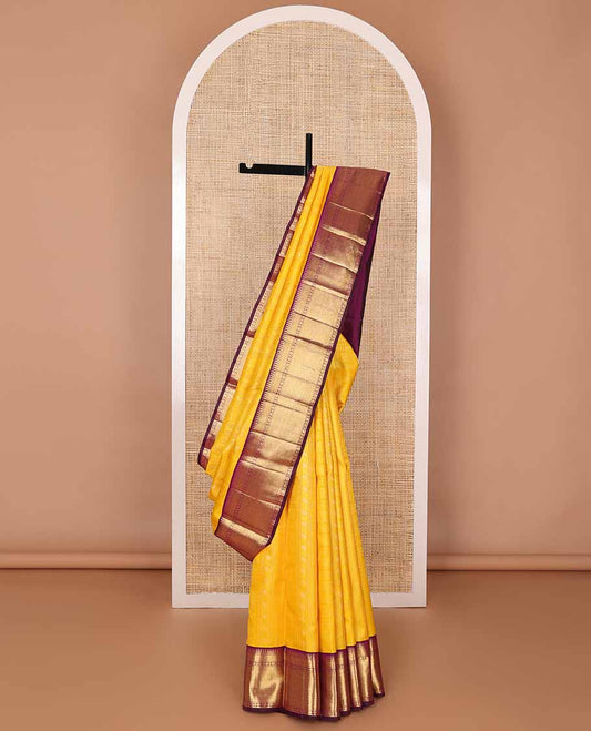 Yellow floral design silk saree with contrast border of rekku, paun, mayil kann design & jaal design pallu
