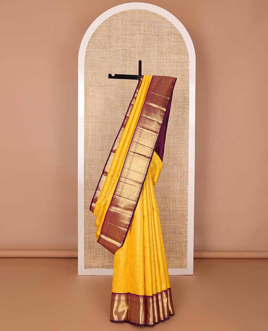 Yellow floral design silk saree with contrast border of rekku, paun, mayil kann design & jaal design pallu